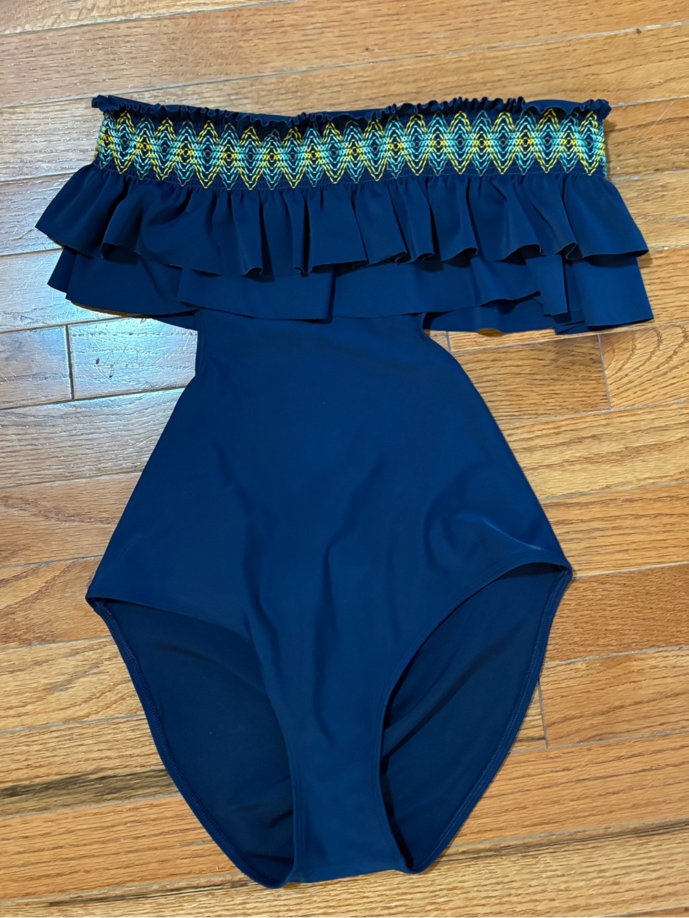 navy blue one-piece swimsuit strapless ruffled top with side cut outs